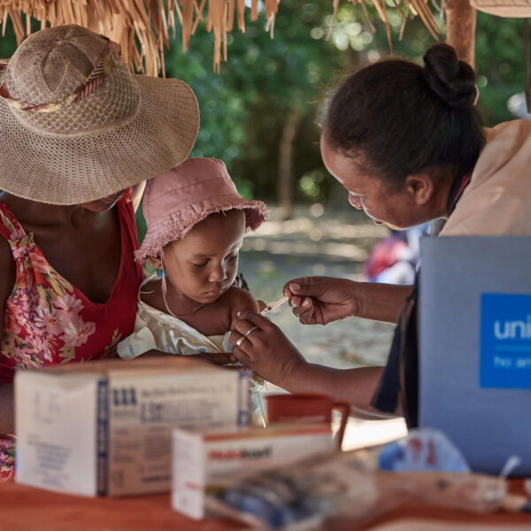 A health worker administers a vaccine dose to 20-month-old Fandresena during a mobile clinic session in Madagascar.